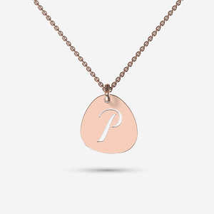 Gold Pebble shaped necklace with cut out initial
